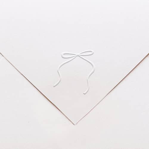 This is a multicolorassorted-colors wedding stationery by Tara Grangroth called bow embosser in standard