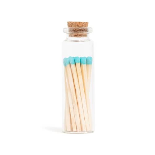 This is a blue matchbooks by Summer Hedglin called aqua lagoon matchsticks in small corked vial in standard