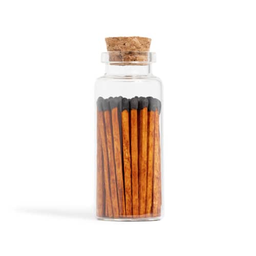 This is a brown matchbooks by Summer Hedglin called cinnamon black matchsticks in medium corked vial in standard