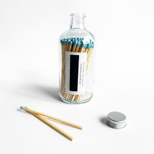 This is a blue matchbooks by Jessica Cunningham called 4" robin's egg blue candle match jar | sky blue long matches in standard