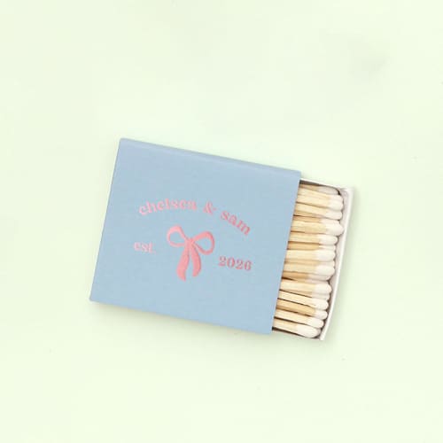 This is a blue matchbooks by ForYourParty called eternal bond bow matchbox, set of 100 in standard
