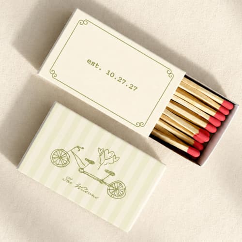 This is a green matchbooks by Paper Haven called tandem bike customizable matchboxes | set of 50 in standard