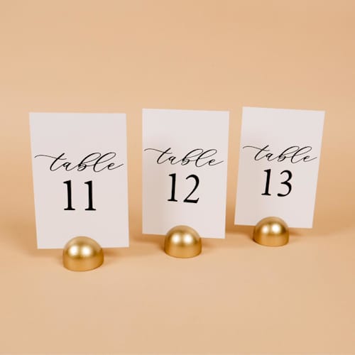 This is a white table numbers by Hanna Roberts called table number | set “11-20” | white & gold in standard