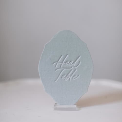 This is a green table numbers by Velvet Raptor called head table sign - sea green in standard