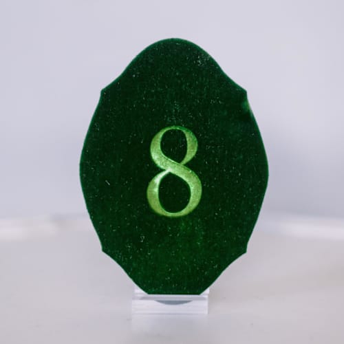 This is a green table numbers by Velvet Raptor called emerald oval table number in standard