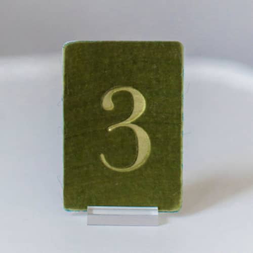 This is a green table numbers by Velvet Raptor called small rectangle table number - avocado in standard