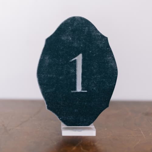 This is a blue table numbers by Velvet Raptor called double sided table number - oval - tourmaline in standard