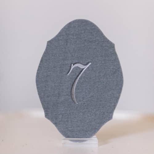This is a gray table numbers by Velvet Raptor called dove script oval table number in standard