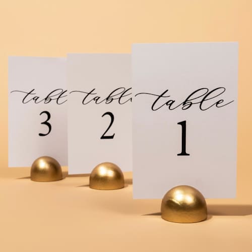 This is a white table numbers by Hanna Roberts called table number | set “1-10” | white & gold in standard