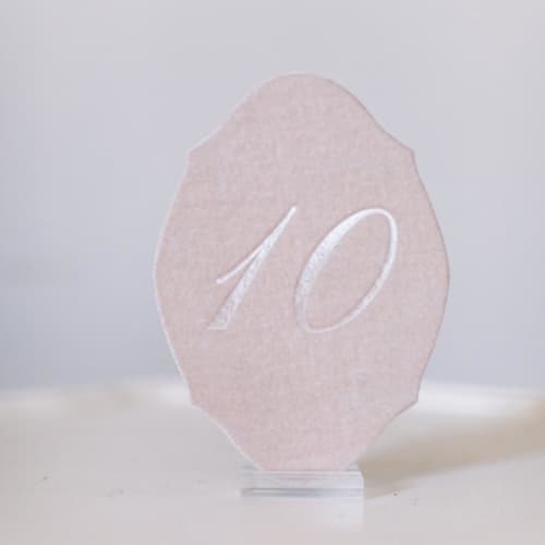 This is a pink table numbers by Velvet Raptor called blush script oval table number in standard