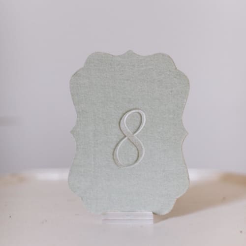 This is a green table numbers by Velvet Raptor called seagreen script scroll table number in standard