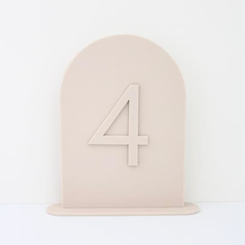 This is a beige table numbers by Haven Print Co. called sand arch table numbers in standard