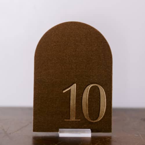 This is a gold table numbers by Velvet Raptor called table number - arch - gold in standard