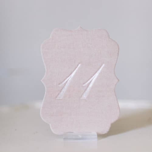 This is a pink table numbers by Velvet Raptor called blush script scroll table number in standard