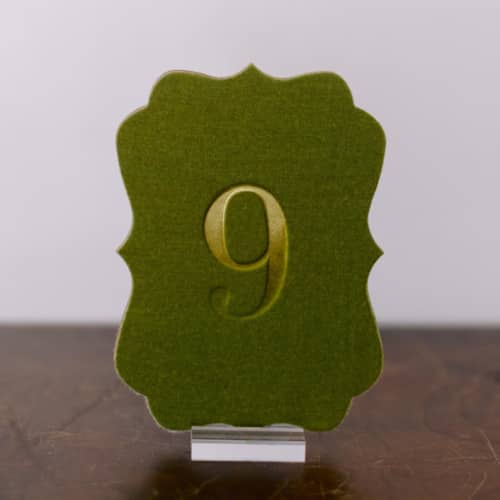 This is a green table numbers by Velvet Raptor called double sided table number - scroll - avocado in standard