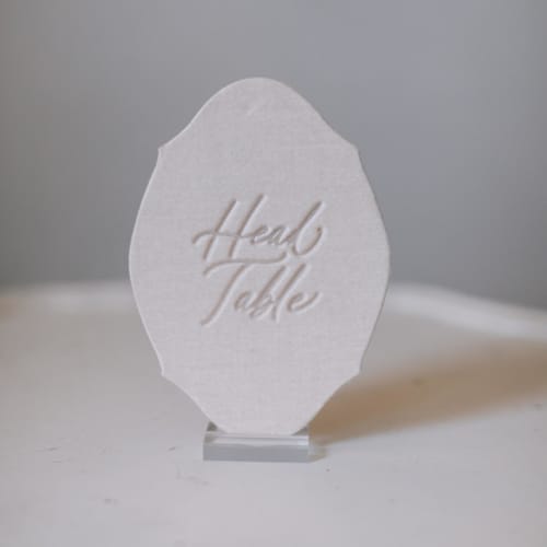 This is a pink table numbers by Velvet Raptor called head table sign - blush in standard