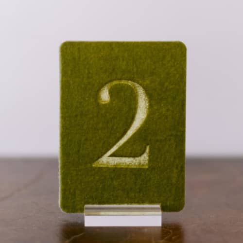 This is a green table numbers by Velvet Raptor called double sided table number - small rectangle - avocado in standard
