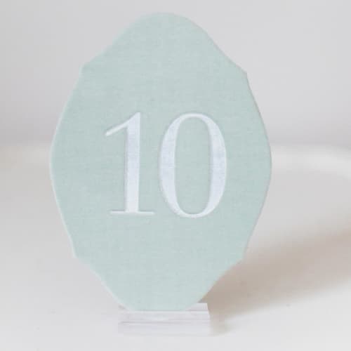 This is a pink table numbers by Velvet Raptor called oval table number - sea green in standard