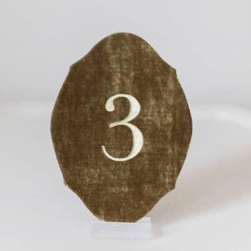 This is a gold table numbers by Velvet Raptor called gold oval table number in standard
