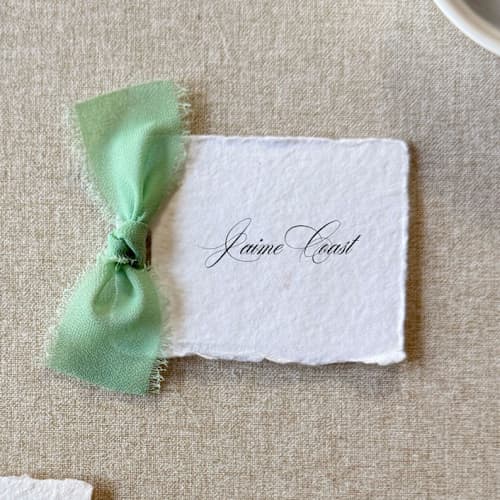 This is a green wedding place cards by Cotton and Bow called handmade paper place cards with sage green bow | set of 10 | custom text in standard