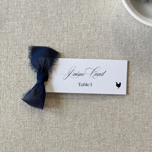 This is a blue wedding place cards by Cotton and Bow called slim place cards with navy blue bow | set of 10 | custom text in standard