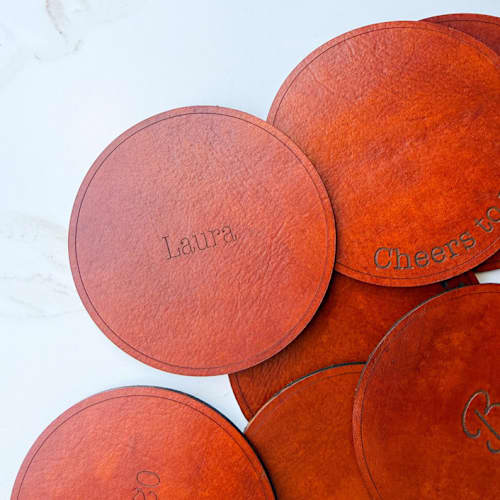 This is a brown wedding place cards by Left Grain called custom leather coaster place cards, set of 10 in standard