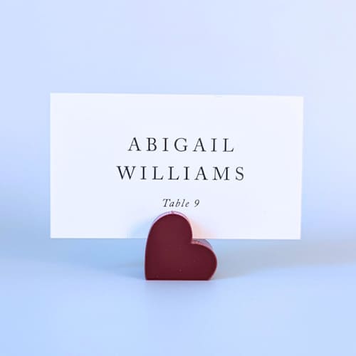 This is a red place card holders by Corduroy Effect called cranberry heart place card holders, set of 10 in standard