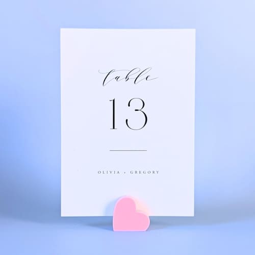 This is a pink place card holders by Corduroy Effect called pink heart table number holders, set of 5 in standard