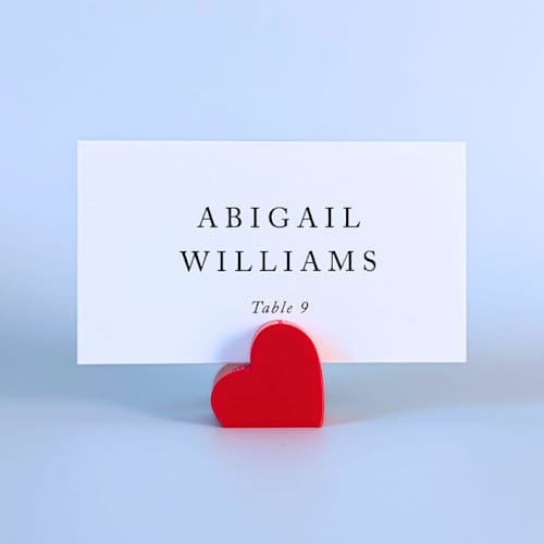 This is a red place card holders by Corduroy Effect called red heart place card holders, set of 10 in standard