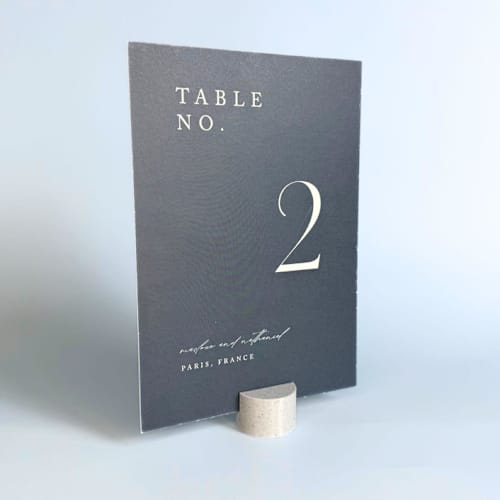 This is a multicolor place card holders by Corduroy Effect called marble pattern circle table number holder, set of 5 in standard
