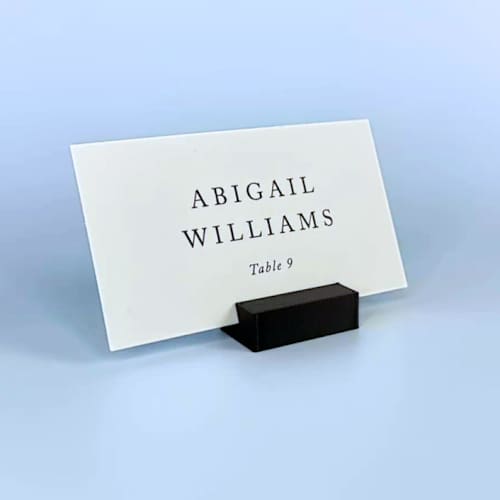 This is a black place card holders by Corduroy Effect called black rectangle place card holder, set of 25 in standard