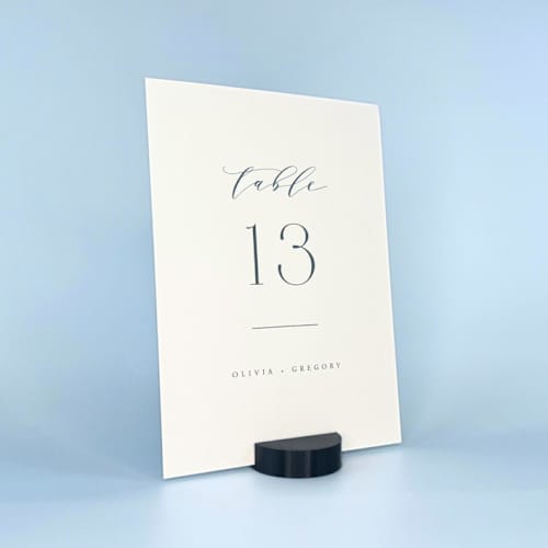 This is a black place card holders by Corduroy Effect called black round table number holder, set of 5 in standard