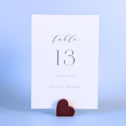 This is a red place card holders by Corduroy Effect called cranberry heart table number holders, set of 5 in standard