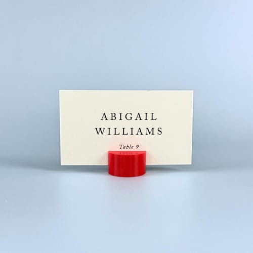 This is a red place card holders by Corduroy Effect called red circle place card holder, set of 25 in standard