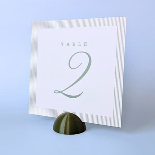 This is a green place card holders by Corduroy Effect called army green dome table number holders, set of 5 in standard