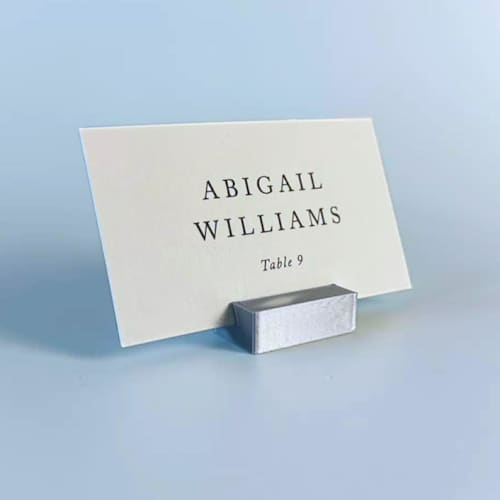 This is a silver place card holders by Corduroy Effect called silver color rectangle place card holder, set of 25 in standard