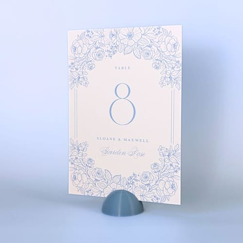 This is a blue place card holders by Corduroy Effect called dusty blue dome table number holders, set of 5 in standard