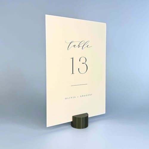 This is a green place card holders by Corduroy Effect called army green circle table number holder, set of 5 in standard