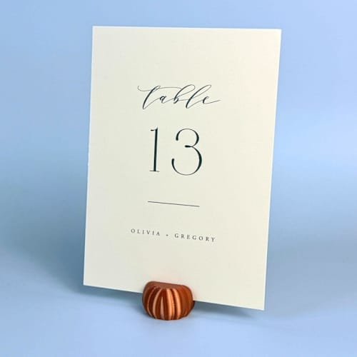 This is a copper place card holders by Corduroy Effect called copper color pumpkin table number holder, set of 5 in standard