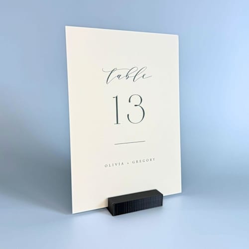 This is a black place card holders by Corduroy Effect called black rectangle table number holder, set of 5 in standard