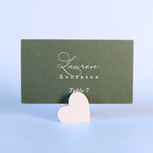 This is a white place card holders by Corduroy Effect called white heart place card holders, set of 10 in standard