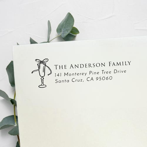 This is a black address labels by Samantha Malvey called bow drink address stamp | self inking return address stamp in standard