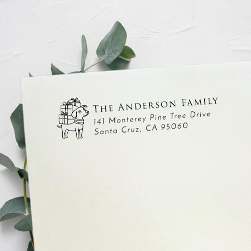 This is a black address labels by Samantha Malvey called christmas dog address stamp | self inking return address stamp in standard
