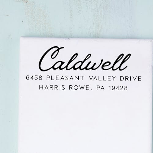 This is a multicolorassorted-colors address labels by Sara Luke called retro script address stamp with a vintage look | wood handle stamp in standard
