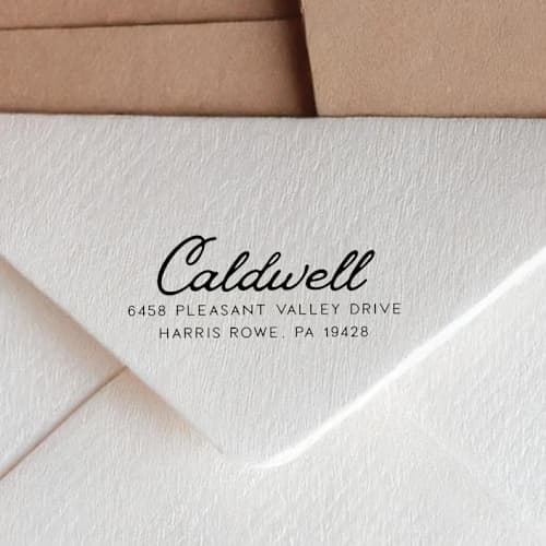 This is a black address labels by Sara Luke called retro script address stamp with a vintage look | self-inking in standard