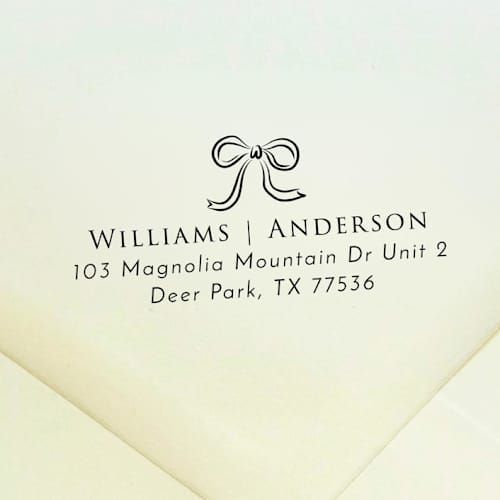 This is a black address labels by Samantha Malvey called ribbon bow address stamp | self inking return address stamp in standard