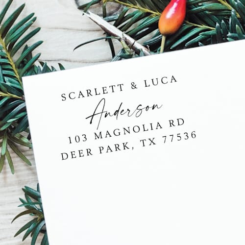 This is a black address labels by Samantha Malvey called calligraphy couple names address stamp | self inking return address stamp in standard
