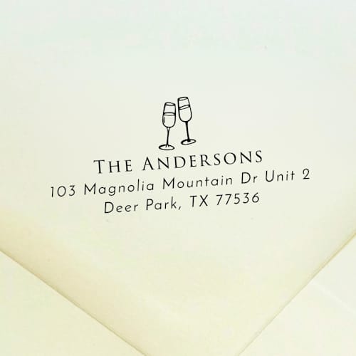 This is a black address labels by Samantha Malvey called champagne glasses address stamp | self inking return address stamp in standard