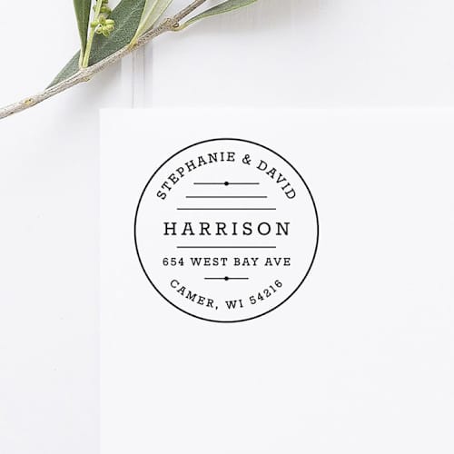 This is a black address labels by Port of Reverie called retro return address stamp, round self inking in standard