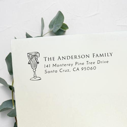 This is a black address labels by Samantha Malvey called bow cocktail address stamp | self inking return address stamp in standard